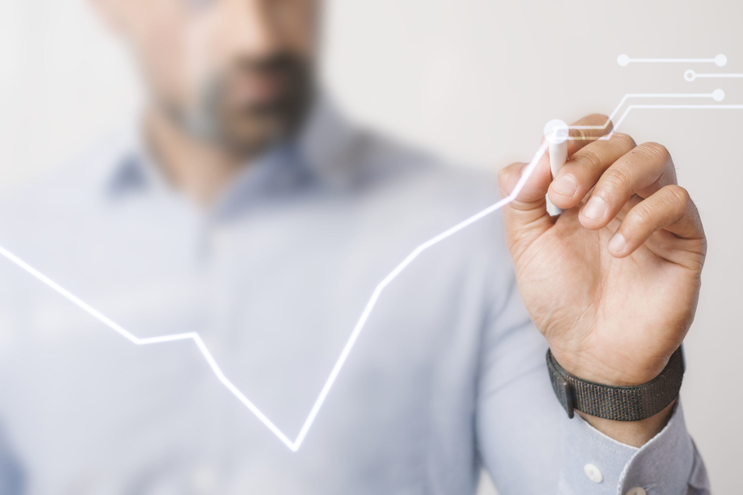 Man giving a business presentation using a futuristic digital pe Man giving a business presentation using a futuristic digital pen